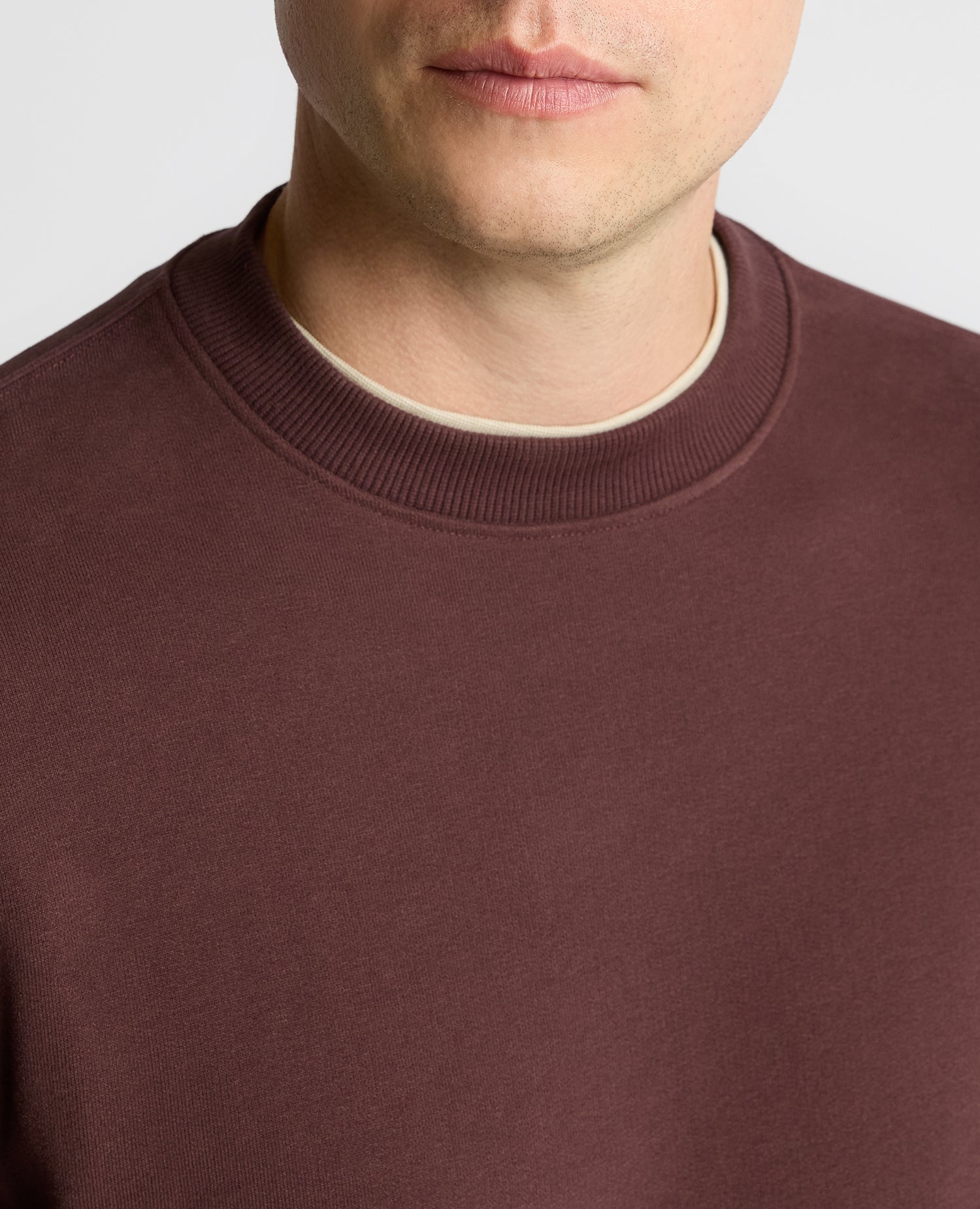 Man wearing a brown Crew Neck Terry Sweatshirt