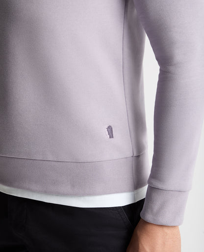 Man wearing a purple  jumper
