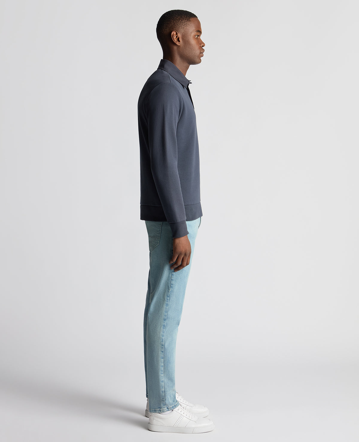Man wearing a navy Regular Fit Organic Cotton-Stretch Jersey Polo