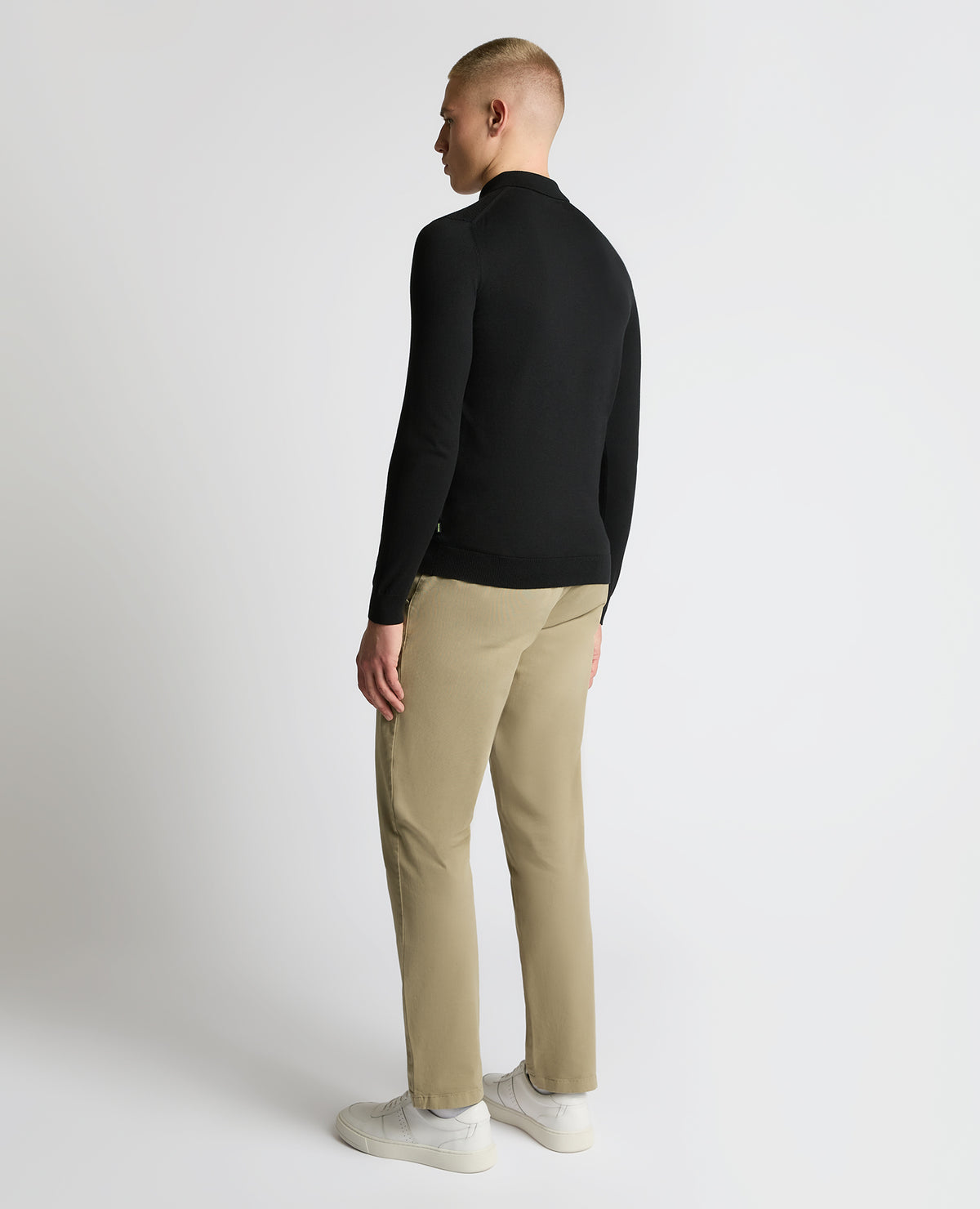 Man wearing a black Cotton Interest Fabric Knit Polo