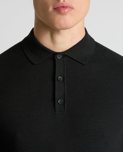 Man wearing a black Cotton Interest Fabric Knit Polo
