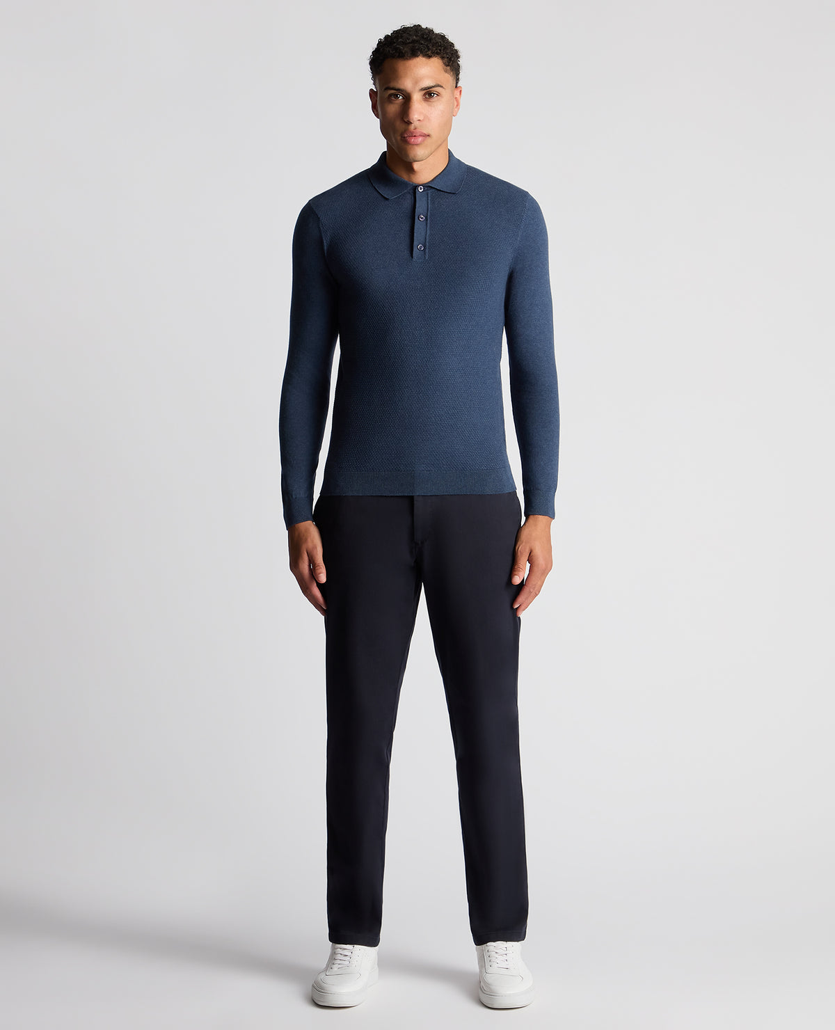 Man wearing a blue Slim Fit Cotton Knitted Polo