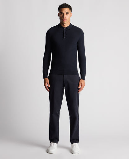Man wearing a navy Slim Fit Cotton Knitted Polo