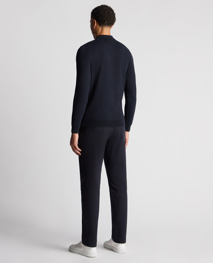 Man wearing a navy Slim Fit Cotton Knitted Polo