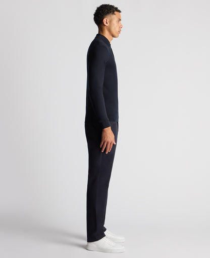 Man wearing a navy Slim Fit Cotton Knitted Polo