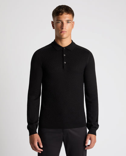 Man wearing a black Slim Fit Merino Wool-Blend Knitted Polo