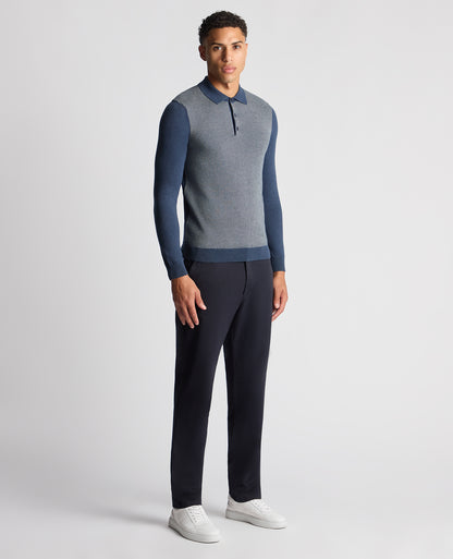 Man wearing a blue Slim Fit Merino Cotton Jacquard Knitted Polo