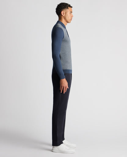 Man wearing a blue Slim Fit Merino Cotton Jacquard Knitted Polo