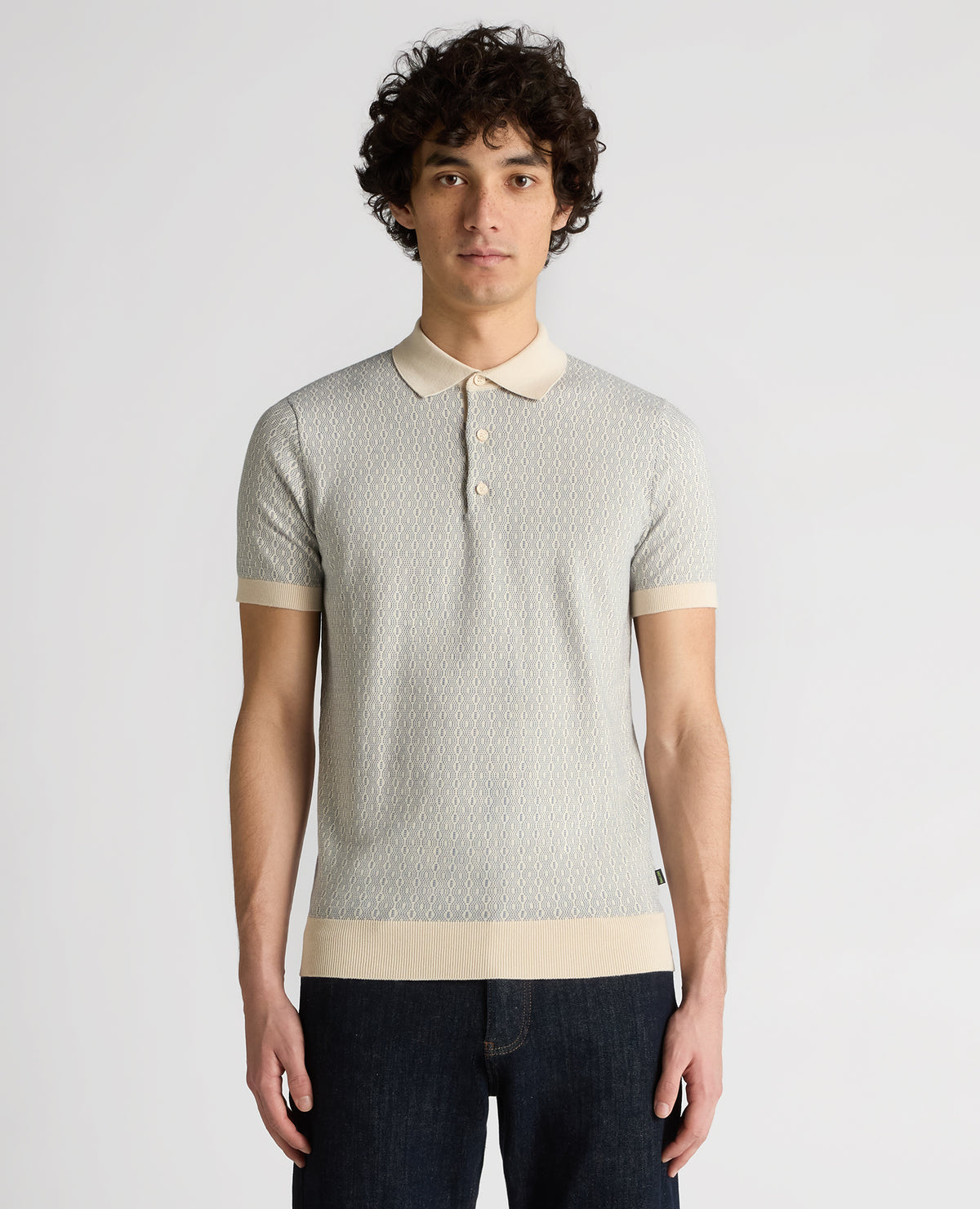 Man wearing a sand Slim Fit Cotton Geometric Polo Shirt