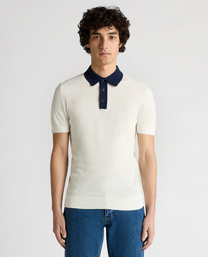 Man wearing a white Slim Fit Cotton Polo Shirt