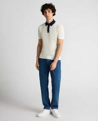 Man wearing a white Slim Fit Cotton Polo Shirt