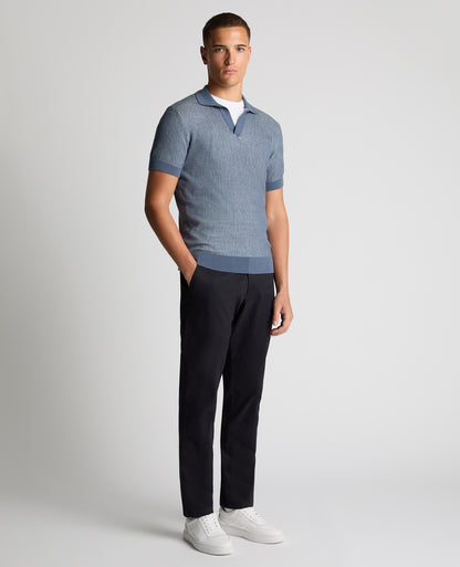 Man wearing a blue Slim Fit Textured Knit Polo