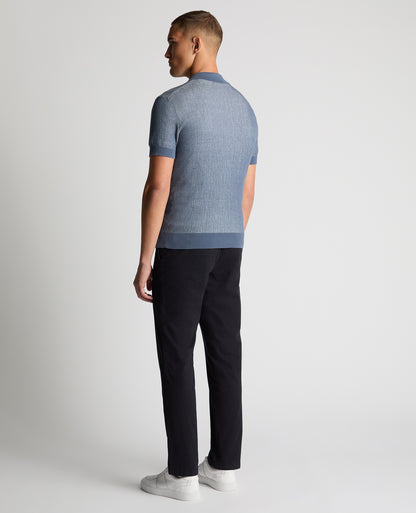 Man wearing a blue Slim Fit Textured Knit Polo
