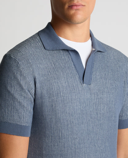 Man wearing a blue Slim Fit Textured Knit Polo