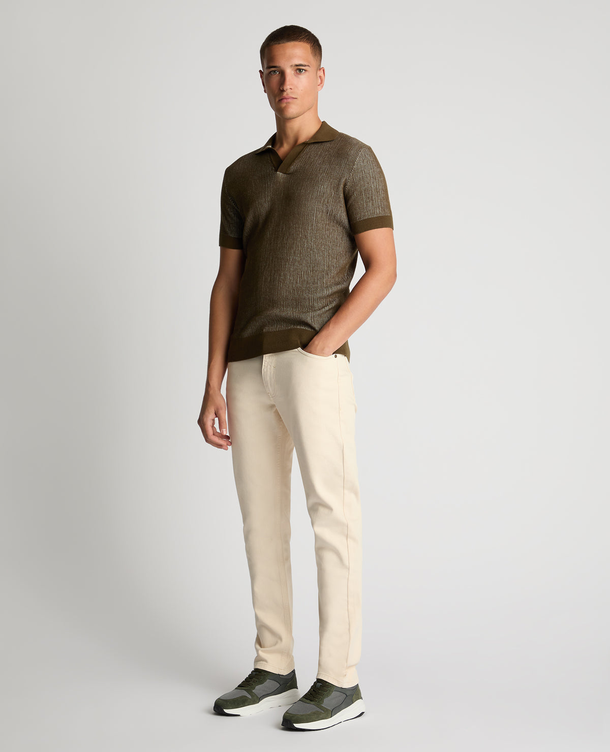 Man wearing a green Slim Fit Textured Knit Polo