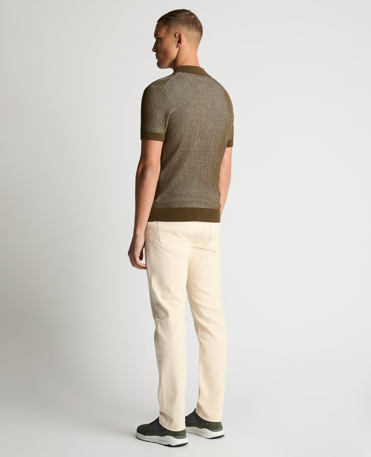 Man wearing a green Slim Fit Textured Knit Polo