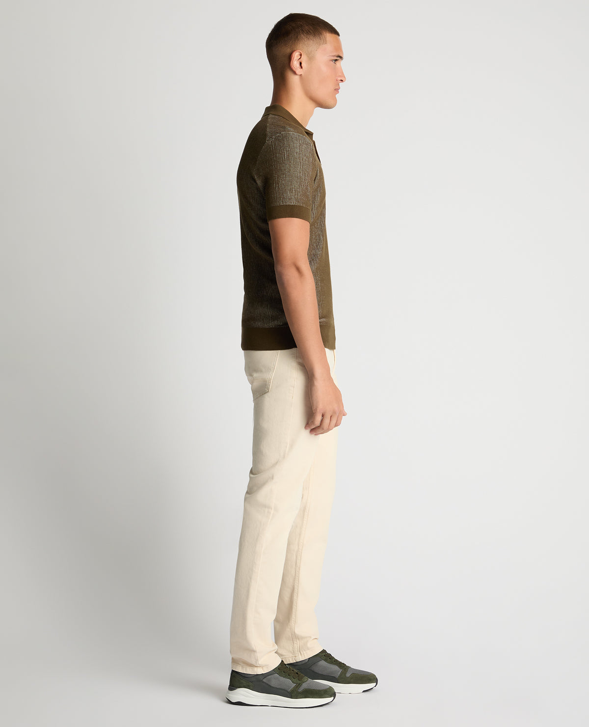 Man wearing a green Slim Fit Textured Knit Polo