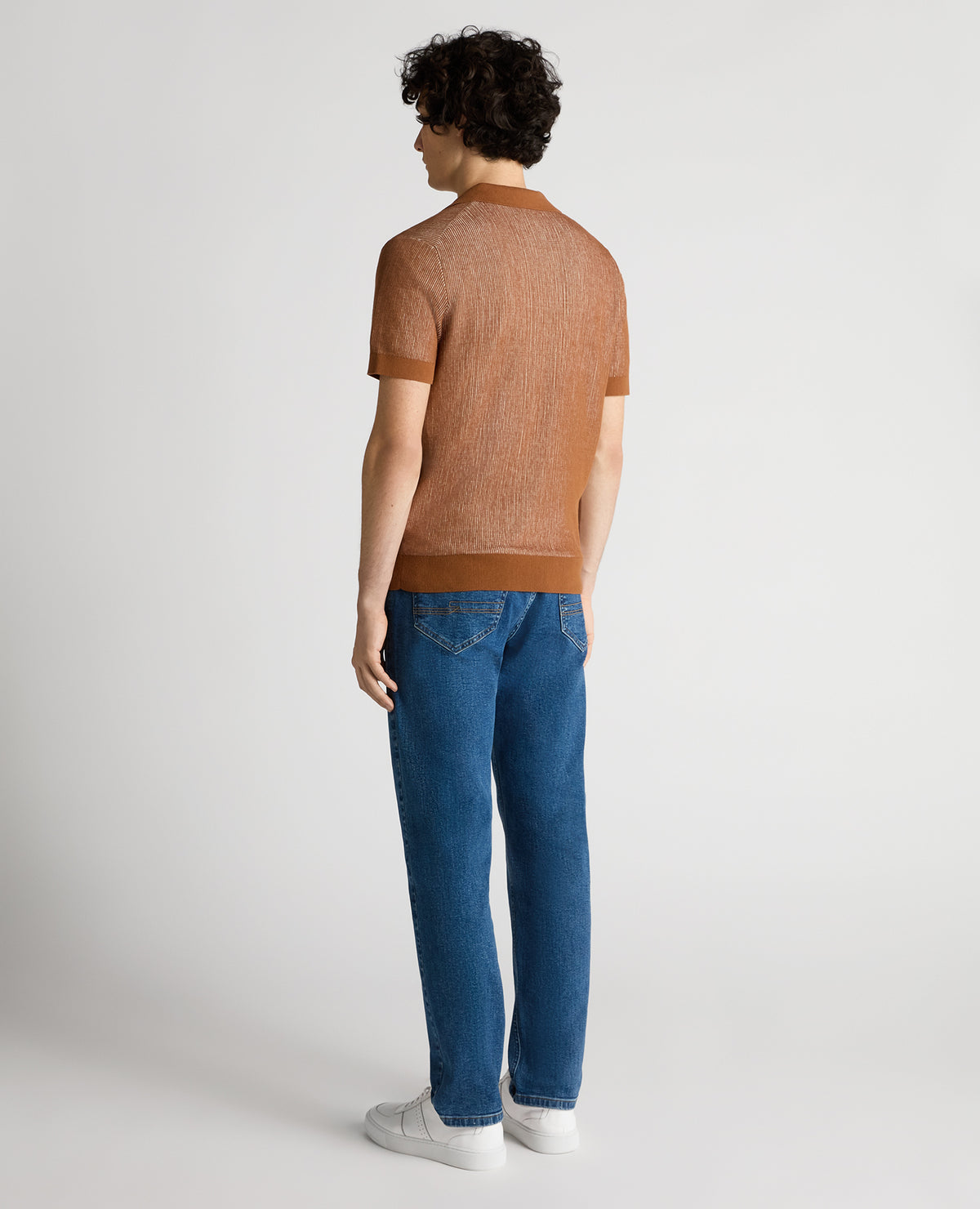 Man wearing a brown Slim Fit Textured Knit Polo