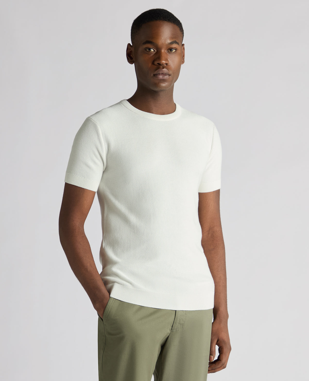 Man wearing a white Slim Fit Wafffle Knitted Tee