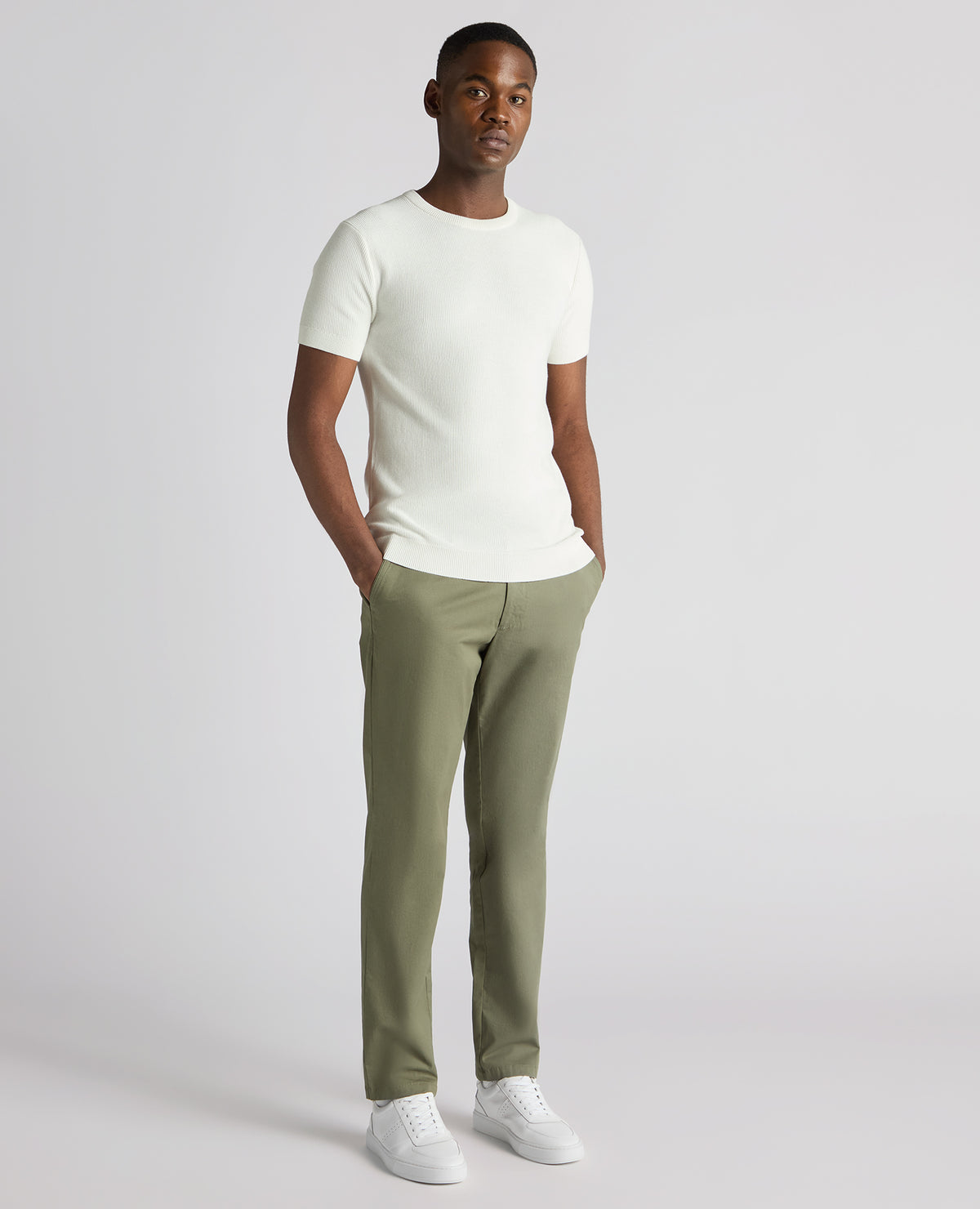 Man wearing a white Slim Fit Wafffle Knitted Tee