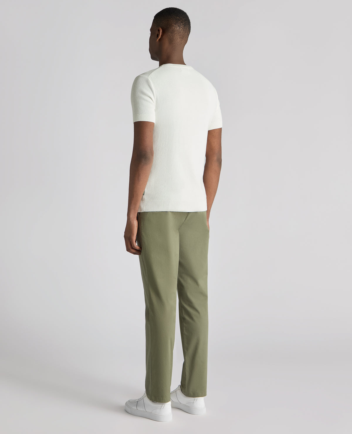 Man wearing a white Slim Fit Wafffle Knitted Tee