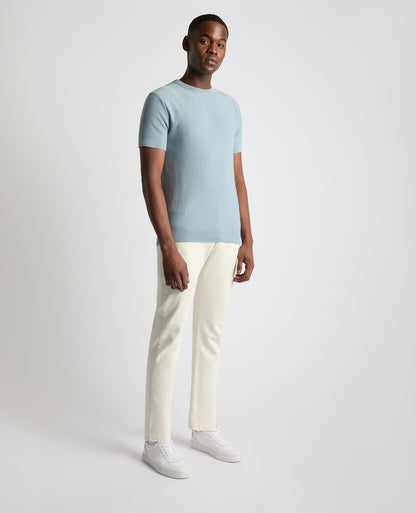 Man wearing a blue Slim Fit Wafffle Knitted Tee