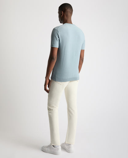Man wearing a blue Slim Fit Wafffle Knitted Tee
