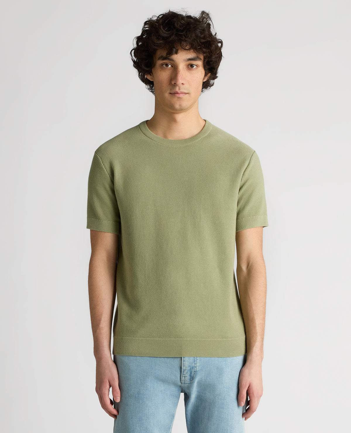 Man wearing a green Slim Fit Wafffle Knitted Tee