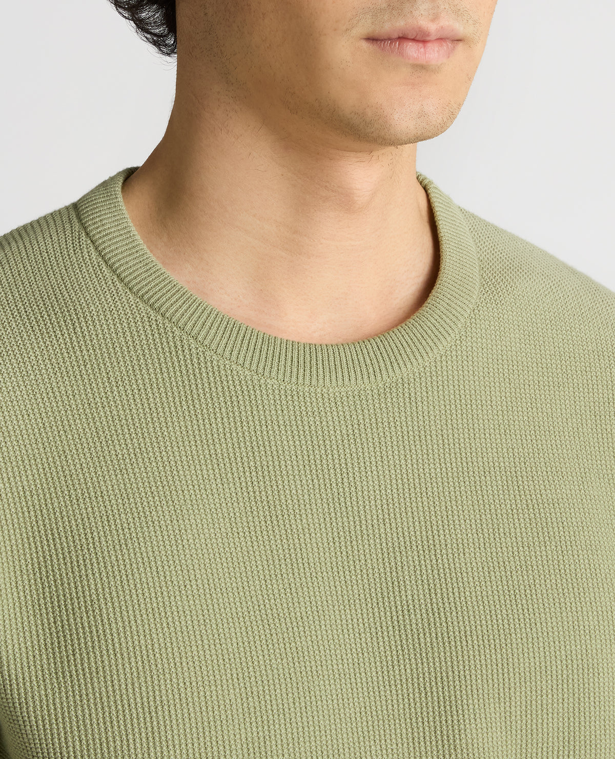 Man wearing a green Slim Fit Wafffle Knitted Tee