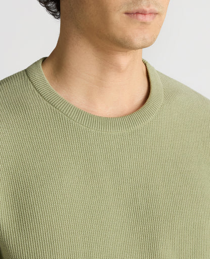 Man wearing a green Slim Fit Wafffle Knitted Tee