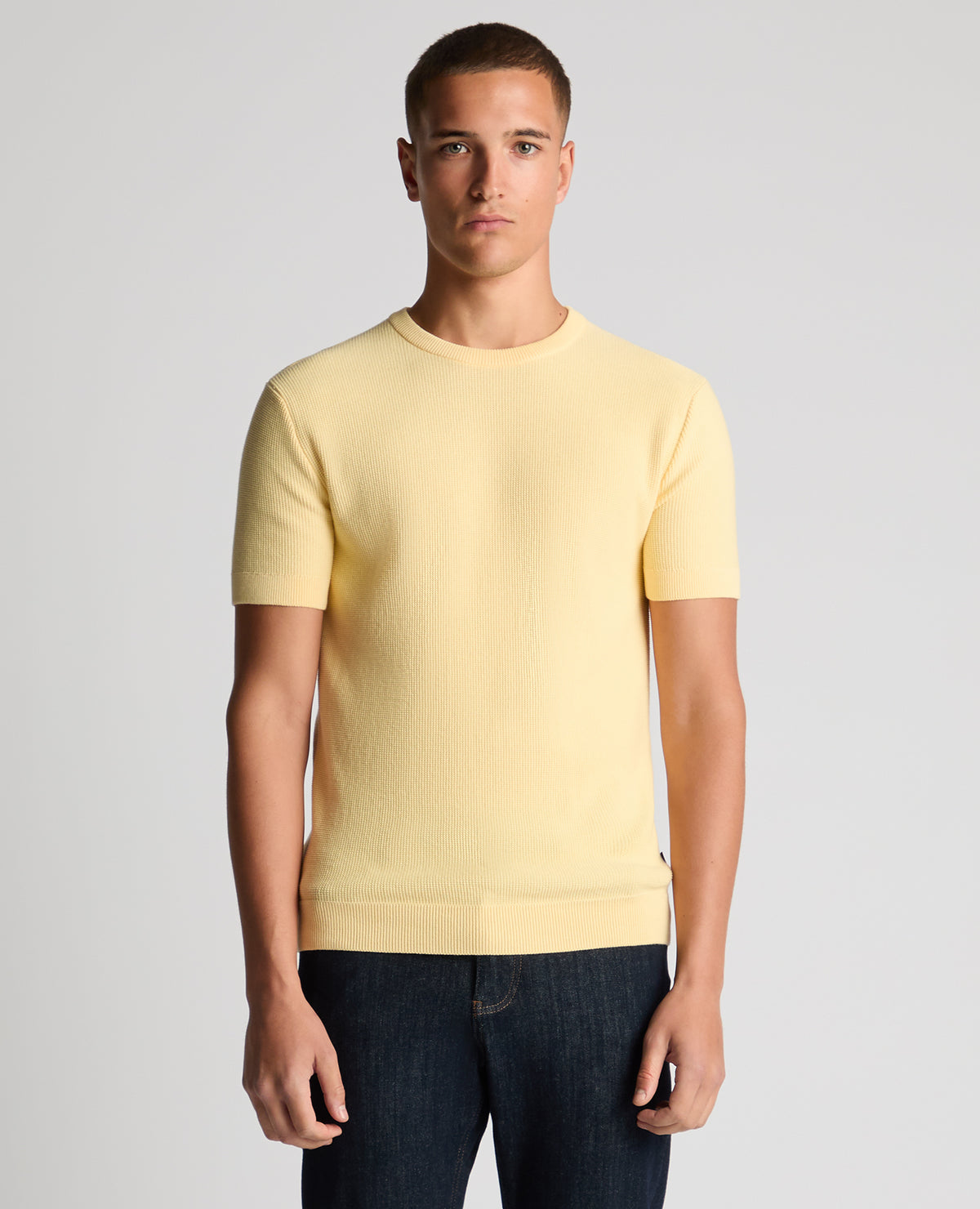Man wearing a orange Slim Fit Wafffle Knitted Tee