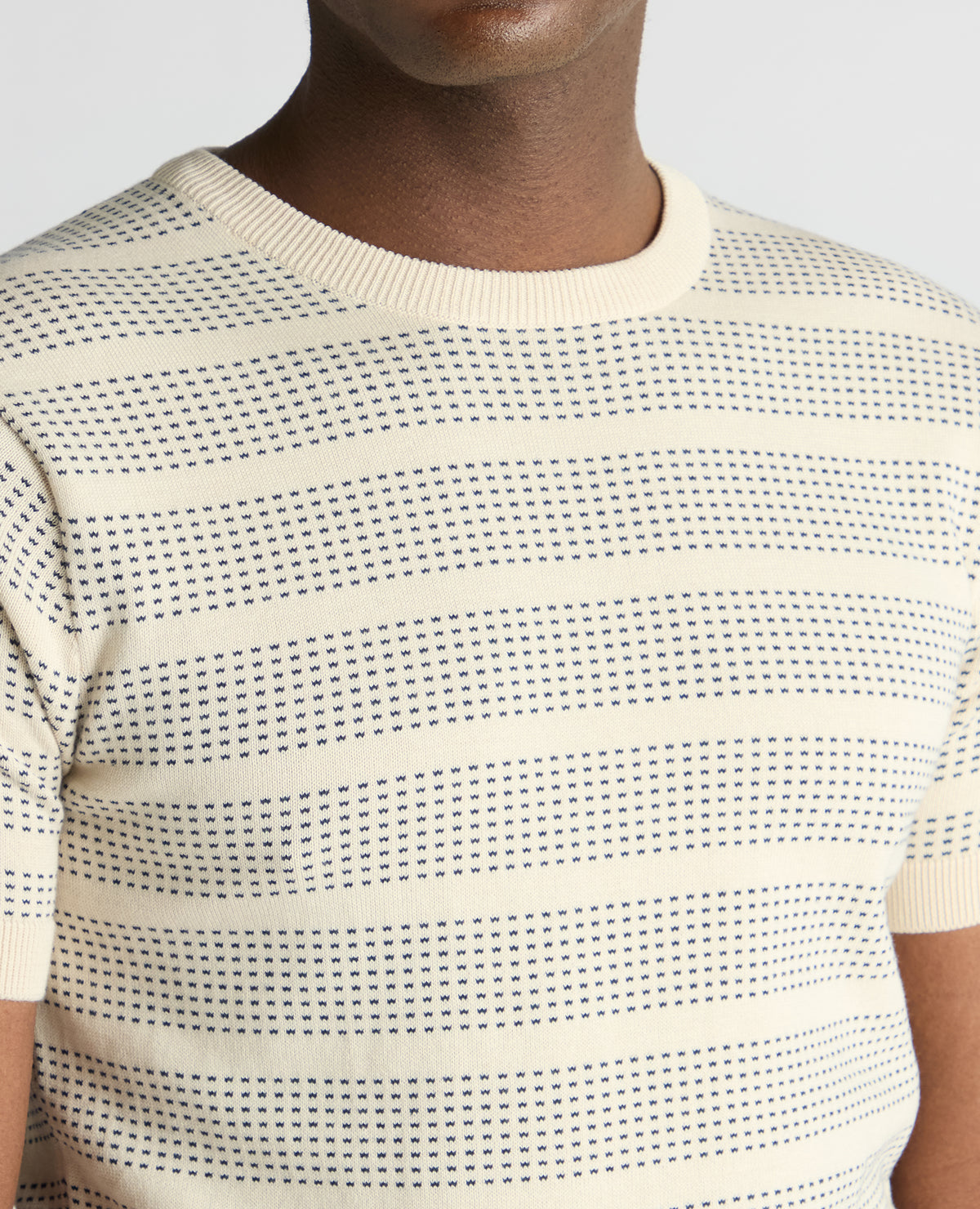 Man wearing a sand Slim Fit Jacquard Tee
