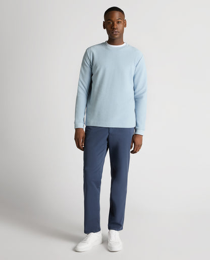 Man wearing a blue Tapered Fit Cotton Micro Waffle Sweatshirt