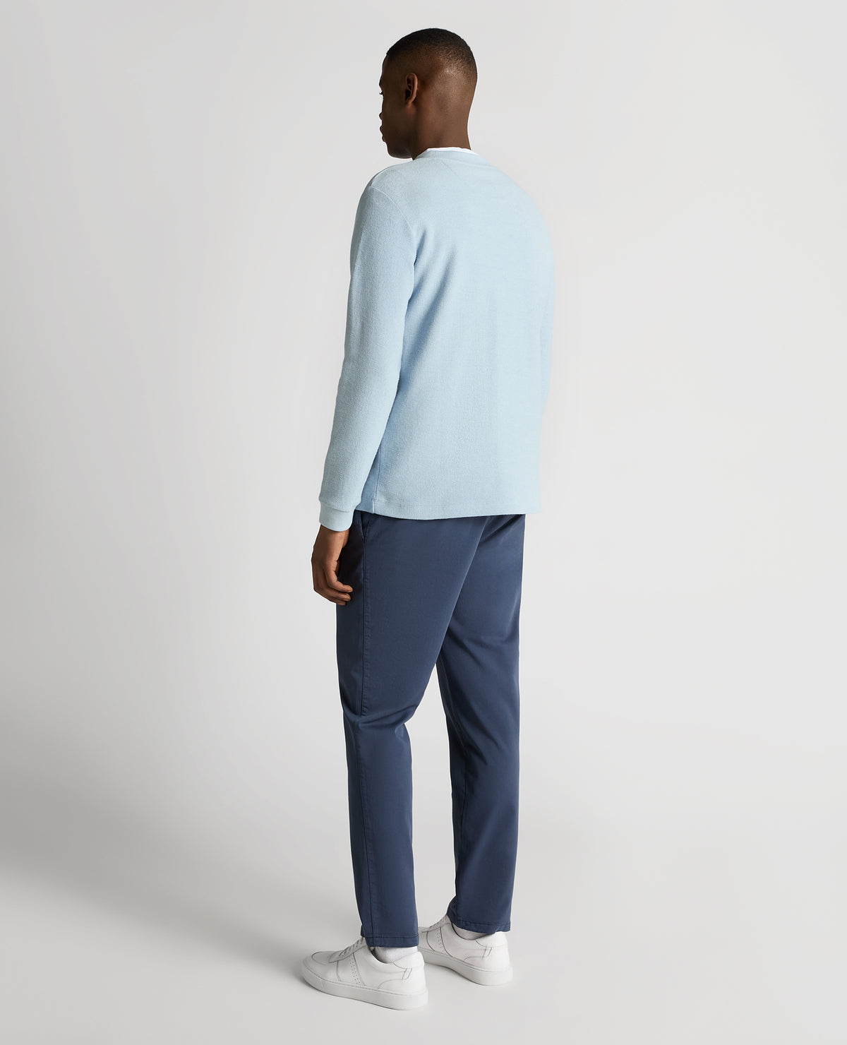 Man wearing a blue Tapered Fit Cotton Micro Waffle Sweatshirt
