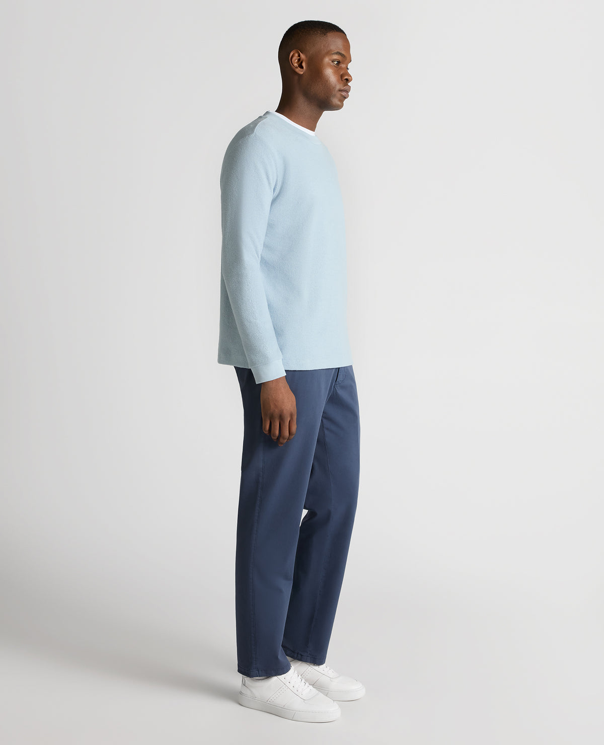 Man wearing a blue Tapered Fit Cotton Micro Waffle Sweatshirt