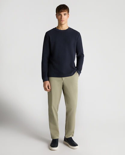 Man wearing a navy Tapered Fit Cotton Micro Waffle Sweatshirt