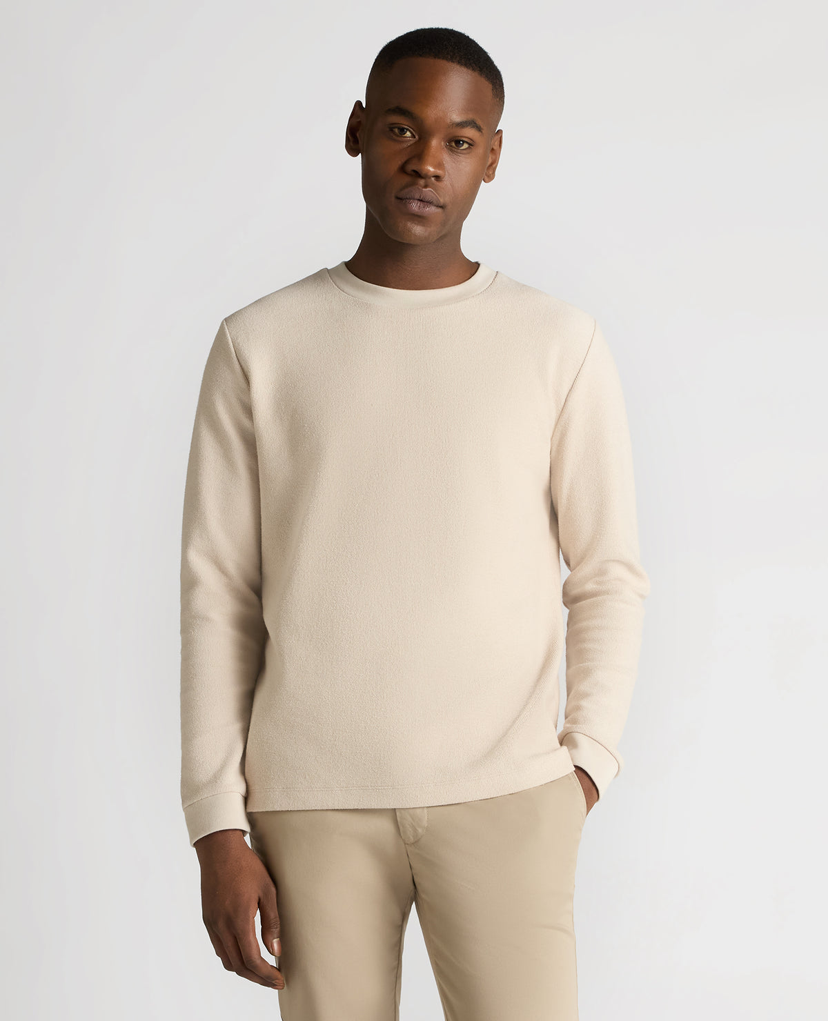 Man wearing a sand Tapered Fit Cotton Micro Waffle Sweatshirt