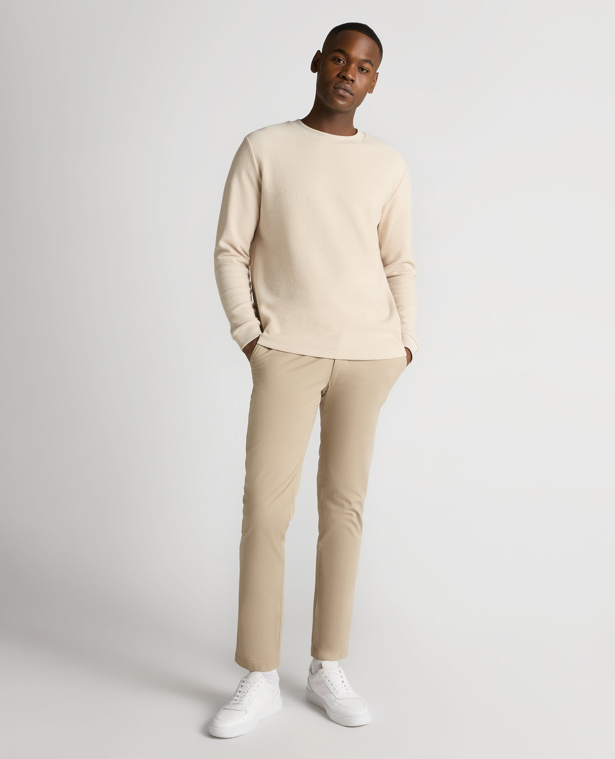 Man wearing a sand Tapered Fit Cotton Micro Waffle Sweatshirt