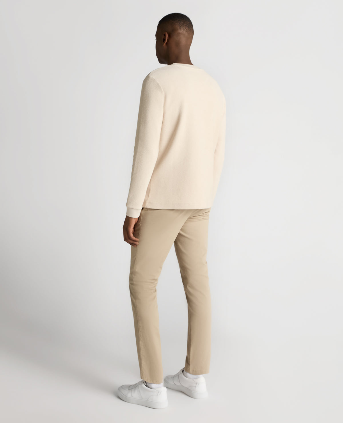 Man wearing a sand Tapered Fit Cotton Micro Waffle Sweatshirt
