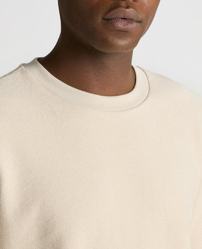 Man wearing a sand Tapered Fit Cotton Micro Waffle Sweatshirt