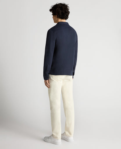 Man wearing a navy Relaxed Fit Cotton-Linen Polo