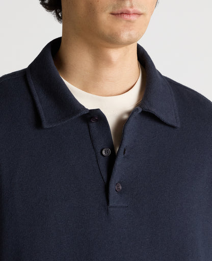 Man wearing a navy Relaxed Fit Cotton-Linen Polo