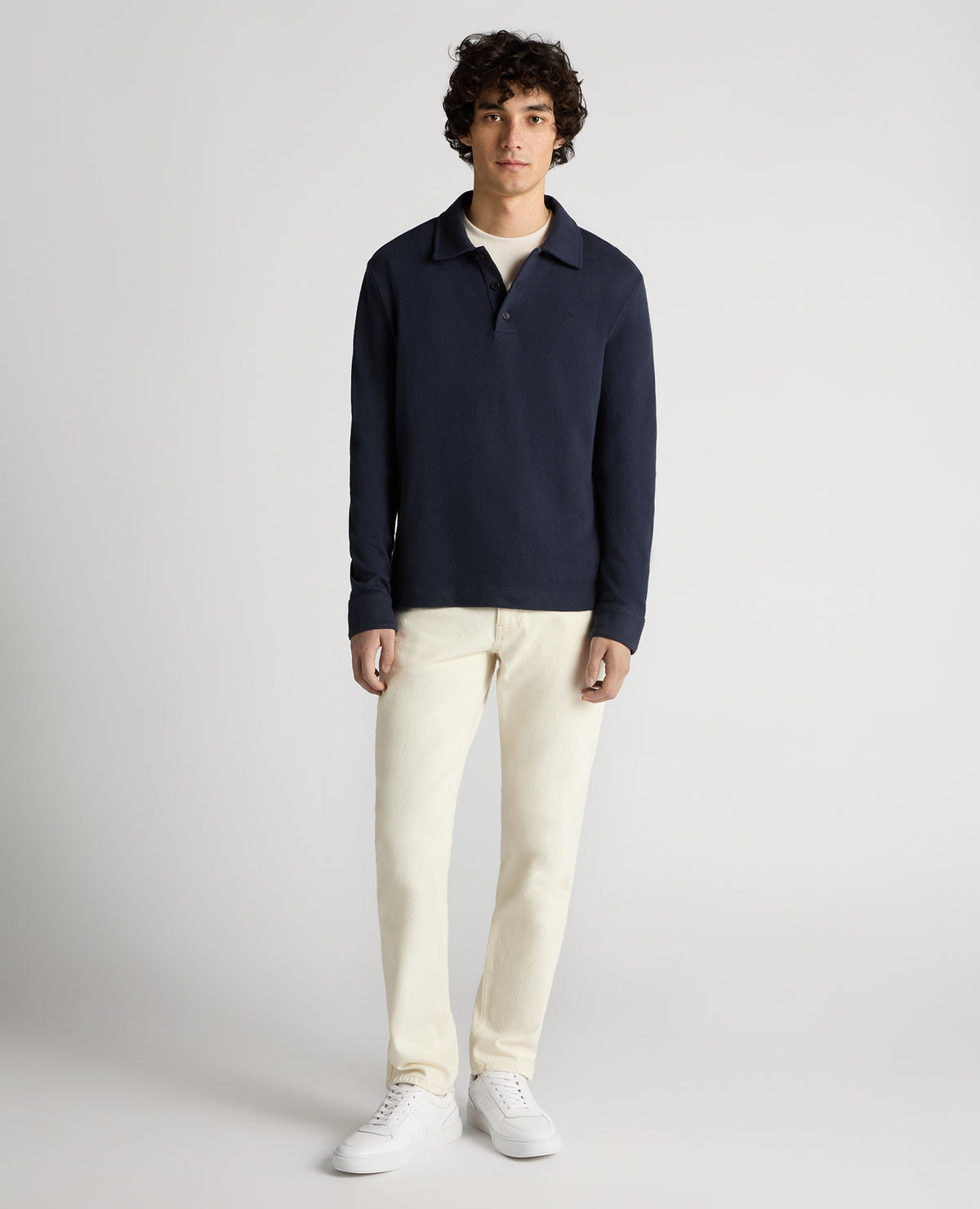 Man wearing a navy Relaxed Fit Cotton-Linen Polo