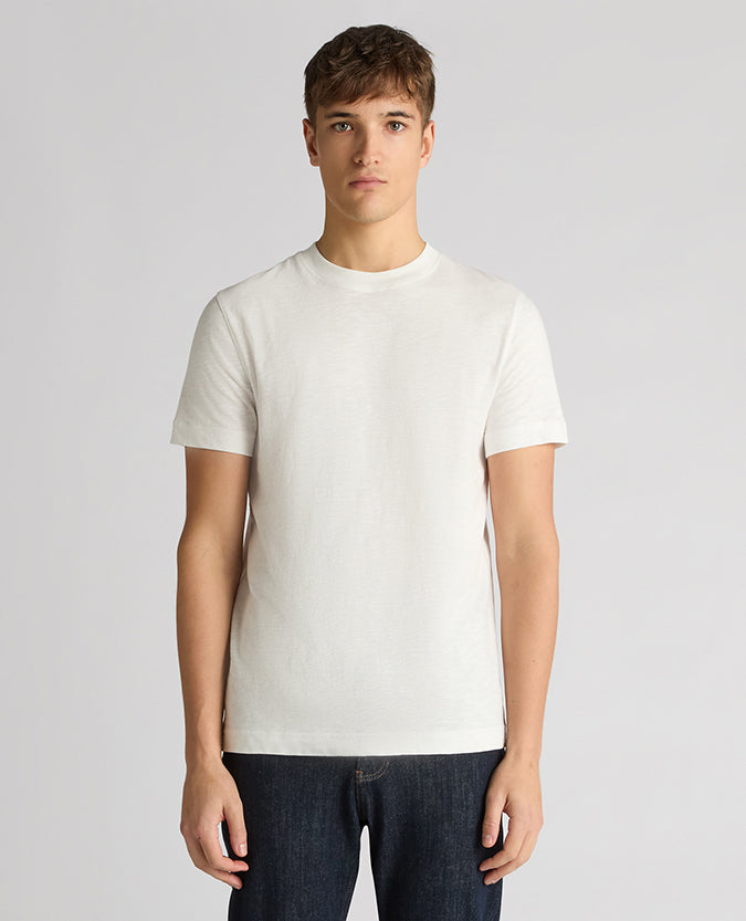 Man wearing a white Tapered Fit Cotton Crew Neck Tee