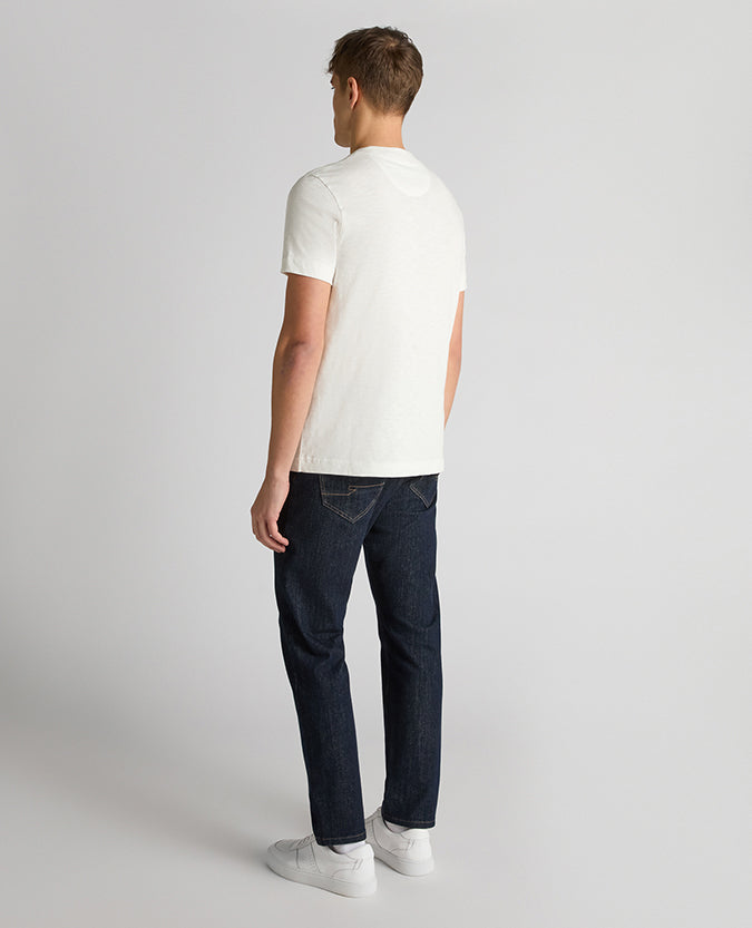 Man wearing a white Tapered Fit Cotton Crew Neck Tee