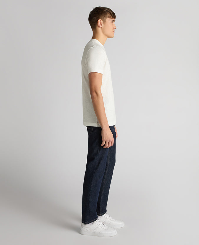 Man wearing a white Tapered Fit Cotton Crew Neck Tee