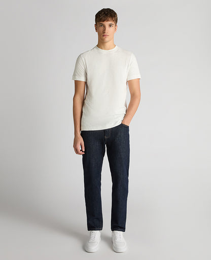 Man wearing a white Tapered Fit Cotton Crew Neck Tee