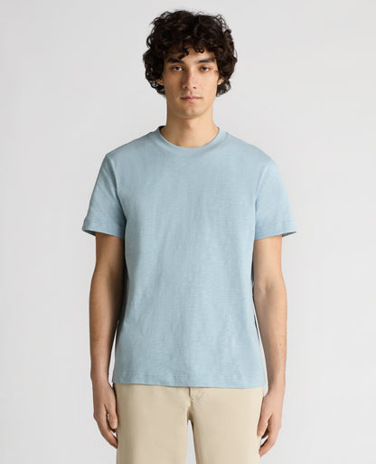 Man wearing a blue Tapered Fit Cotton Crew Neck Tee