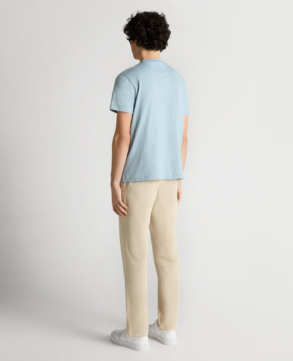 Man wearing a blue Tapered Fit Cotton Crew Neck Tee