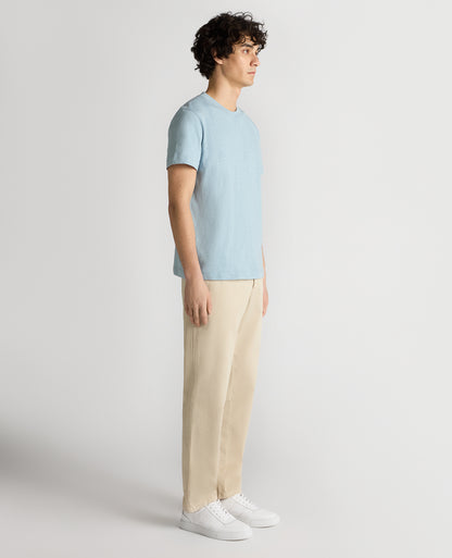 Man wearing a blue Tapered Fit Cotton Crew Neck Tee
